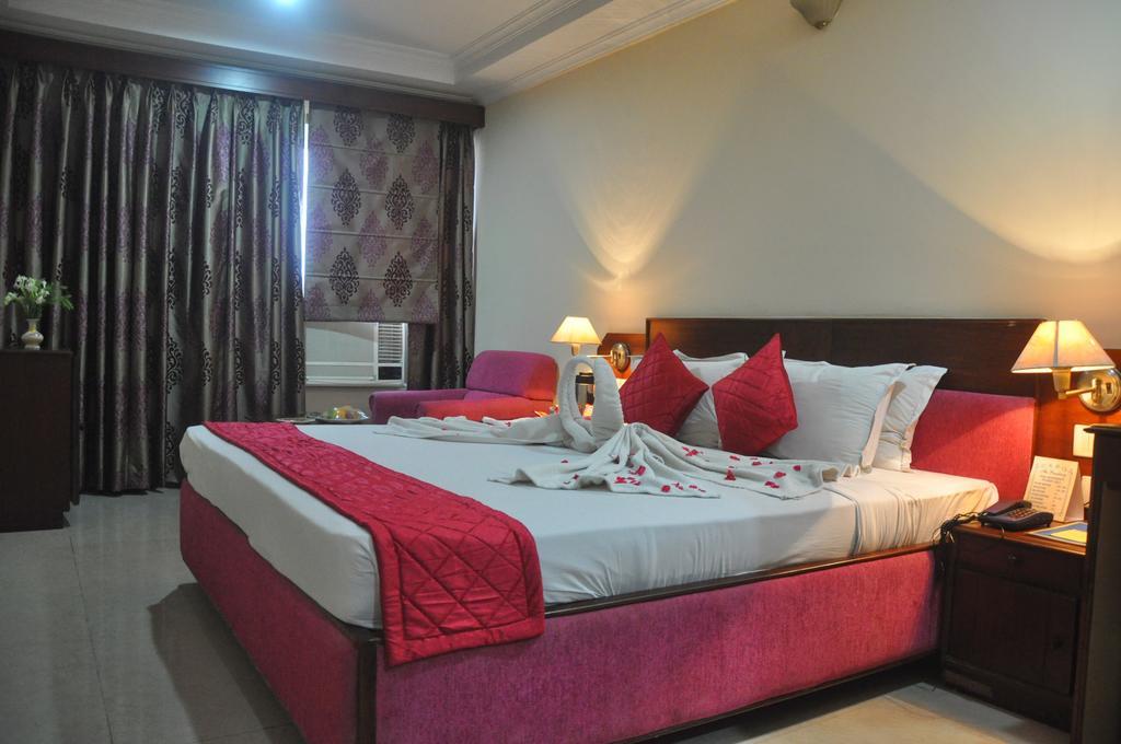 The Presidency Hotel Bhuvanesvar Szoba fotó